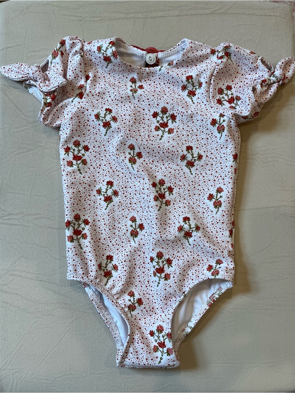 Girls White Floral One-Piece Swimsuit with sleeves & bow details
